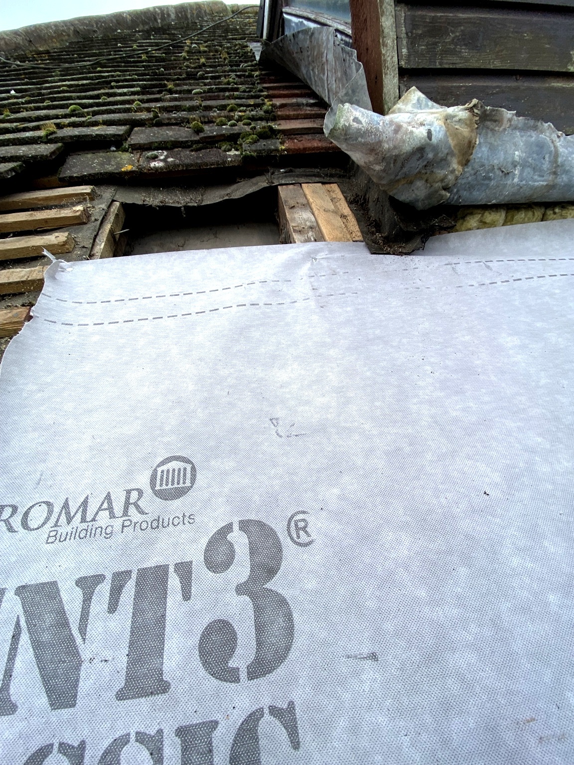Dormer roof repair needed in Stafford — failed lead flashing and silicone patchwork